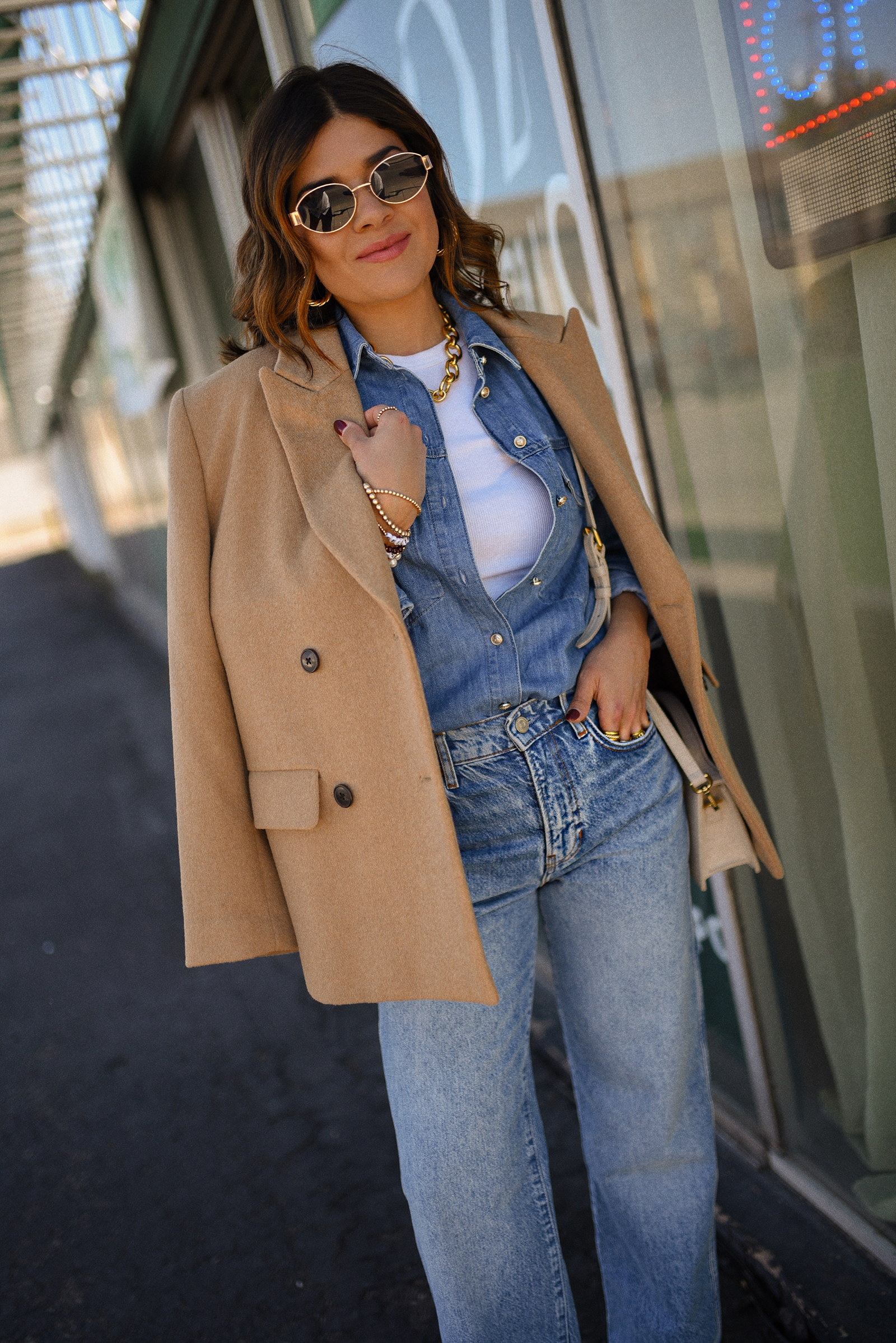 Carolina Hellal of Chic Talk wearing a denim on denim look, shirt via Sezane, wide leg jean from Nordstrom, tank top via Target, Dolce Vita pumps and Jacquemus bag