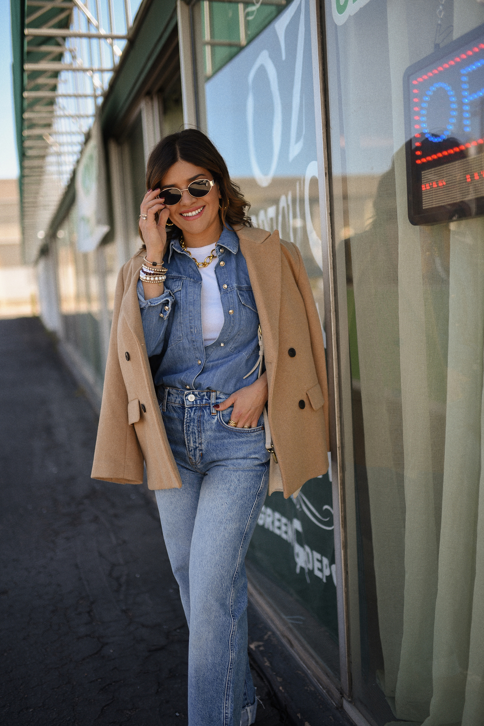 Carolina Hellal of Chic Talk wearing a denim on denim look, shirt via Sezane, wide leg jean from Nordstrom, tank top via Target, Dolce Vita pumps and Jacquemus bag