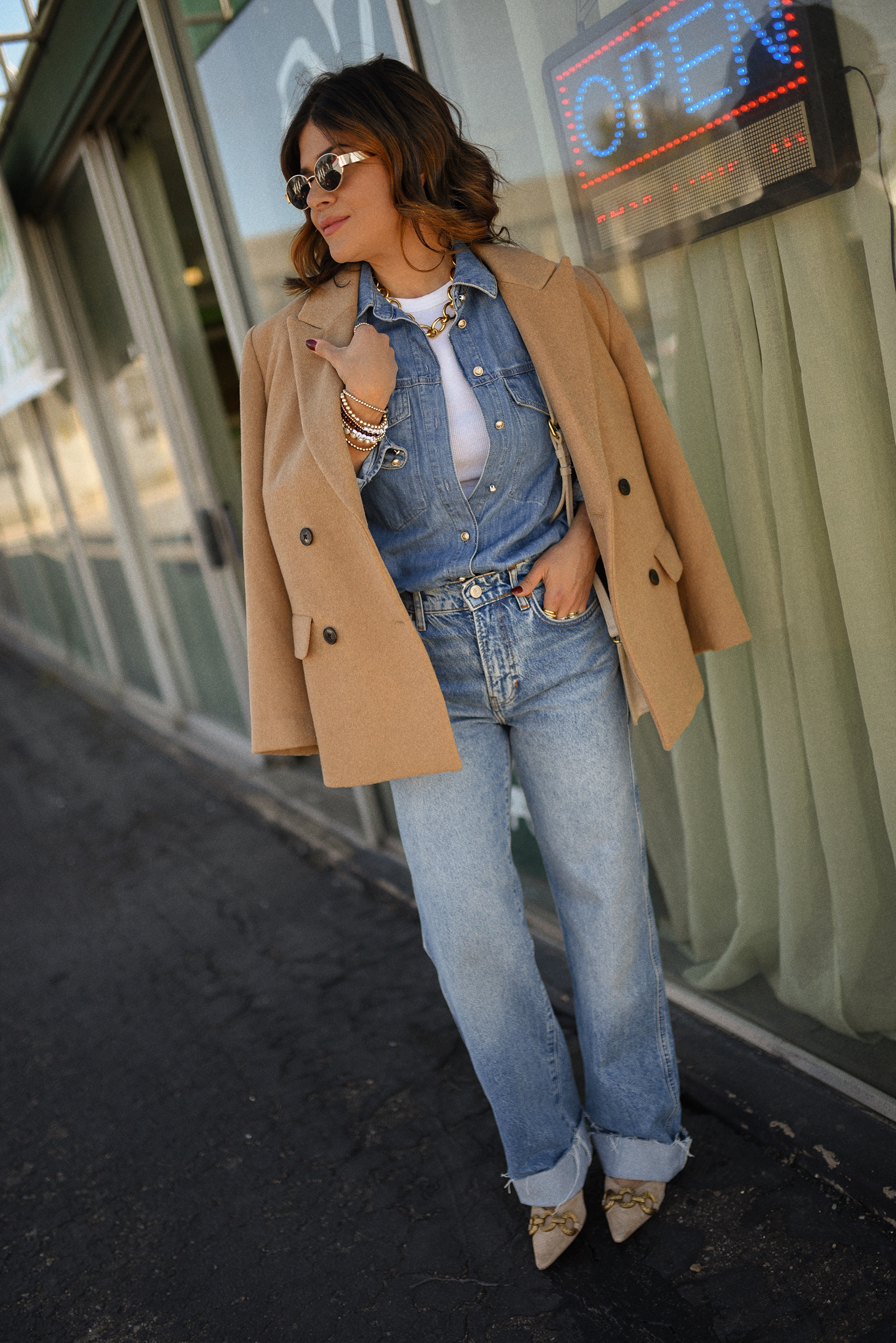 Carolina Hellal of Chic Talk wearing a denim on denim look, shirt via Sezane, wide leg jean from Nordstrom, tank top via Target, Dolce Vita pumps and Jacquemus bag