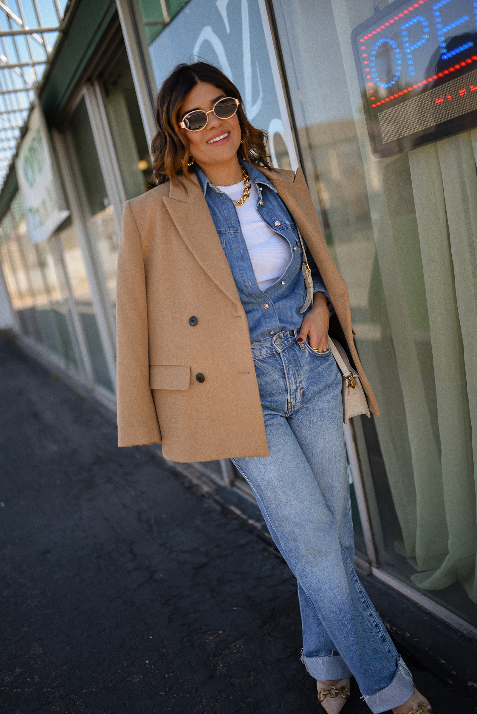 Carolina Hellal of Chic Talk wearing a denim on denim look, shirt via Sezane, wide leg jean from Nordstrom, tank top via Target, Dolce Vita pumps and Jacquemus bag