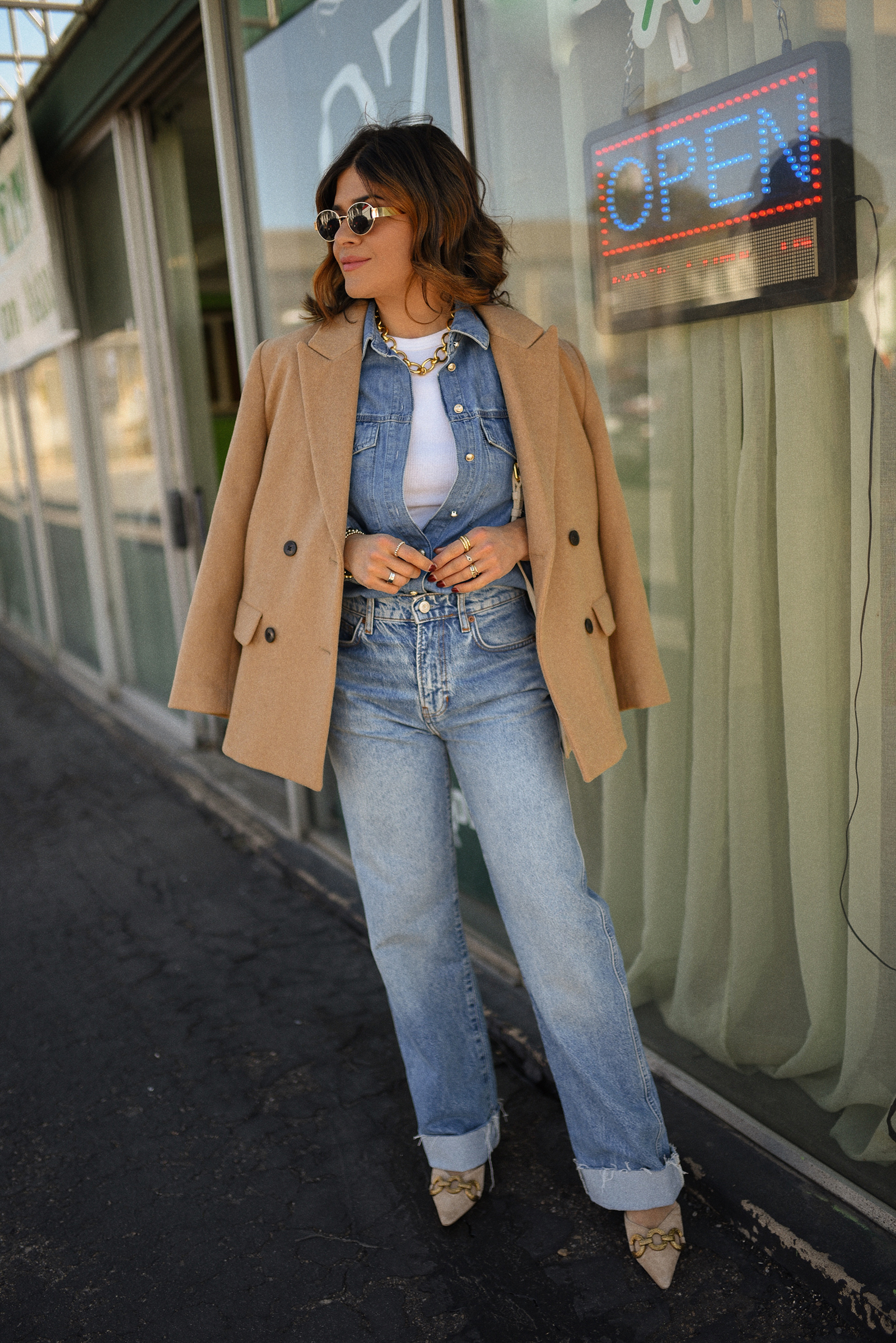 Carolina Hellal of Chic Talk wearing a denim on denim look, shirt via Sezane, wide leg jean from Nordstrom, tank top via Target, Dolce Vita pumps and Jacquemus bag