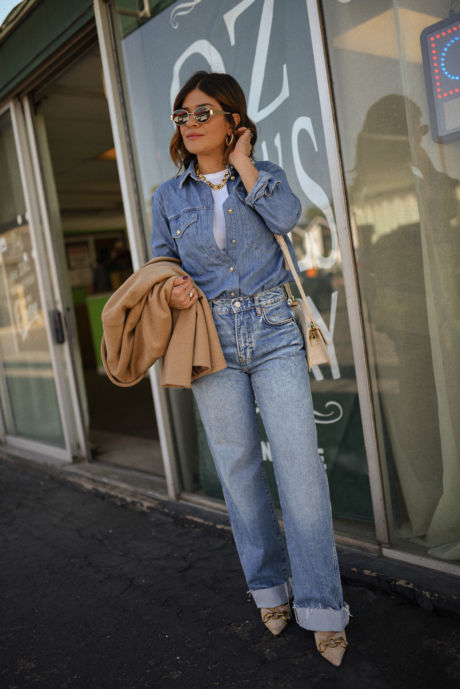 Carolina Hellal of Chic Talk wearing a denim on denim look, shirt via Sezane, wide leg jean from Nordstrom, tank top via Target, Dolce Vita pumps and Jacquemus bag