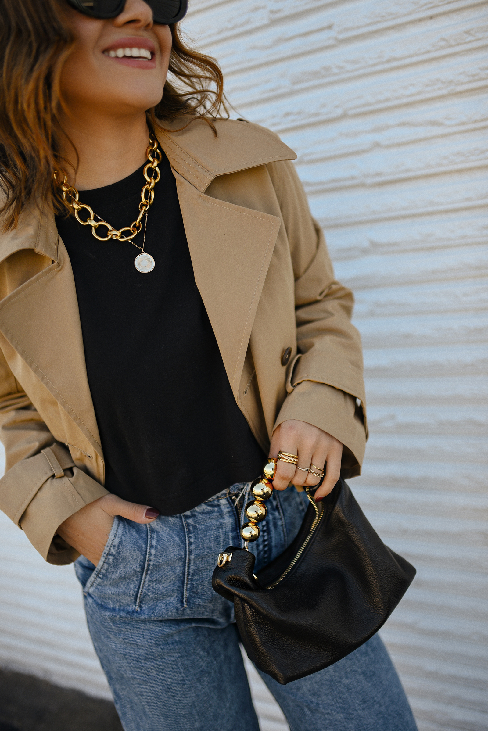 Carolina Hellal of Chic Talk wearing a short trench coat via Abercrombie, tshirt and jeans from Hudson jeans, Nordstrom animal print pumps and Amazon black handbag