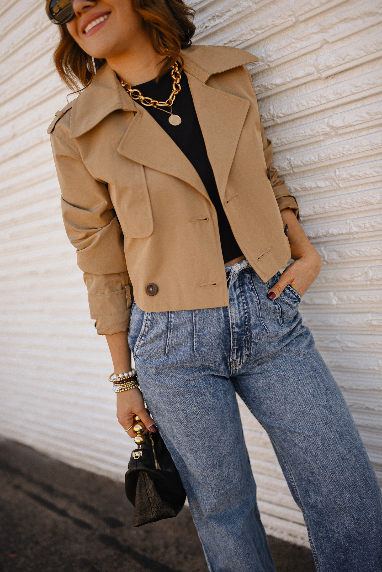 Carolina Hellal of Chic Talk wearing a short trench coat via Abercrombie, tshirt and jeans from Hudson jeans, Nordstrom animal print pumps and Amazon black handbag