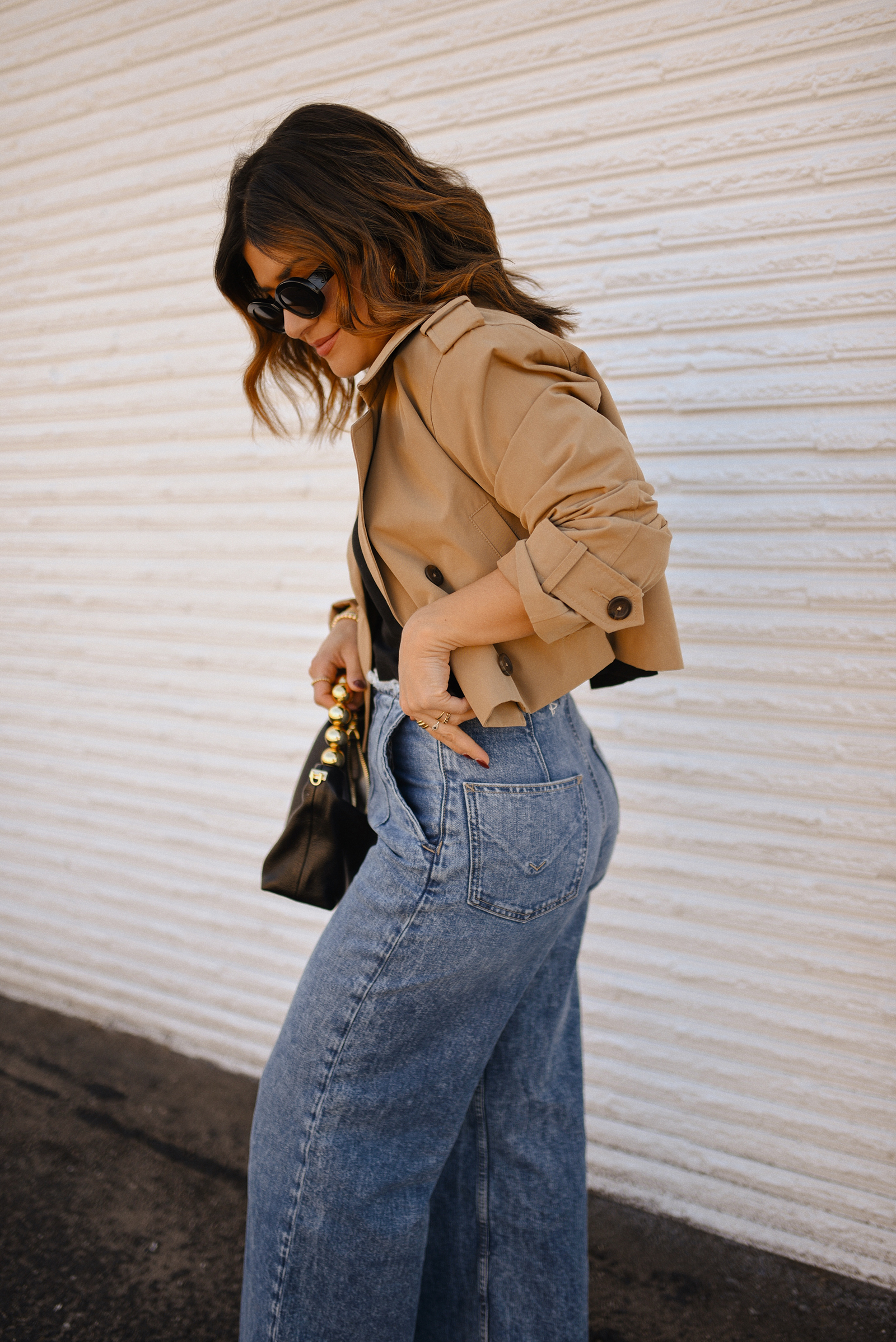 Carolina Hellal of Chic Talk wearing a short trench coat via Abercrombie, tshirt and jeans from Hudson jeans, Nordstrom animal print pumps and Amazon black handbag