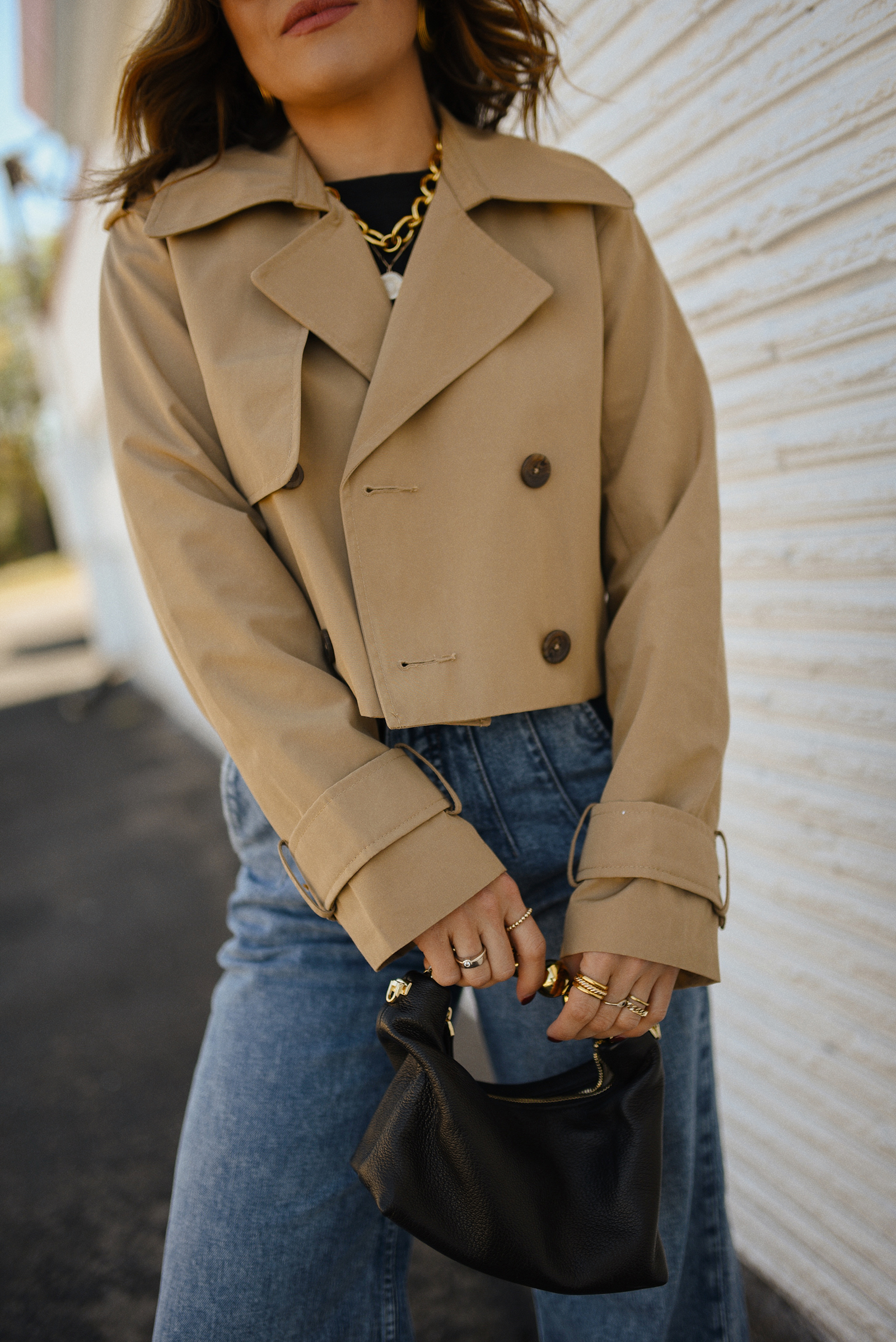 Carolina Hellal of Chic Talk wearing a short trench coat via Abercrombie, tshirt and jeans from Hudson jeans, Nordstrom animal print pumps and Amazon black handbag