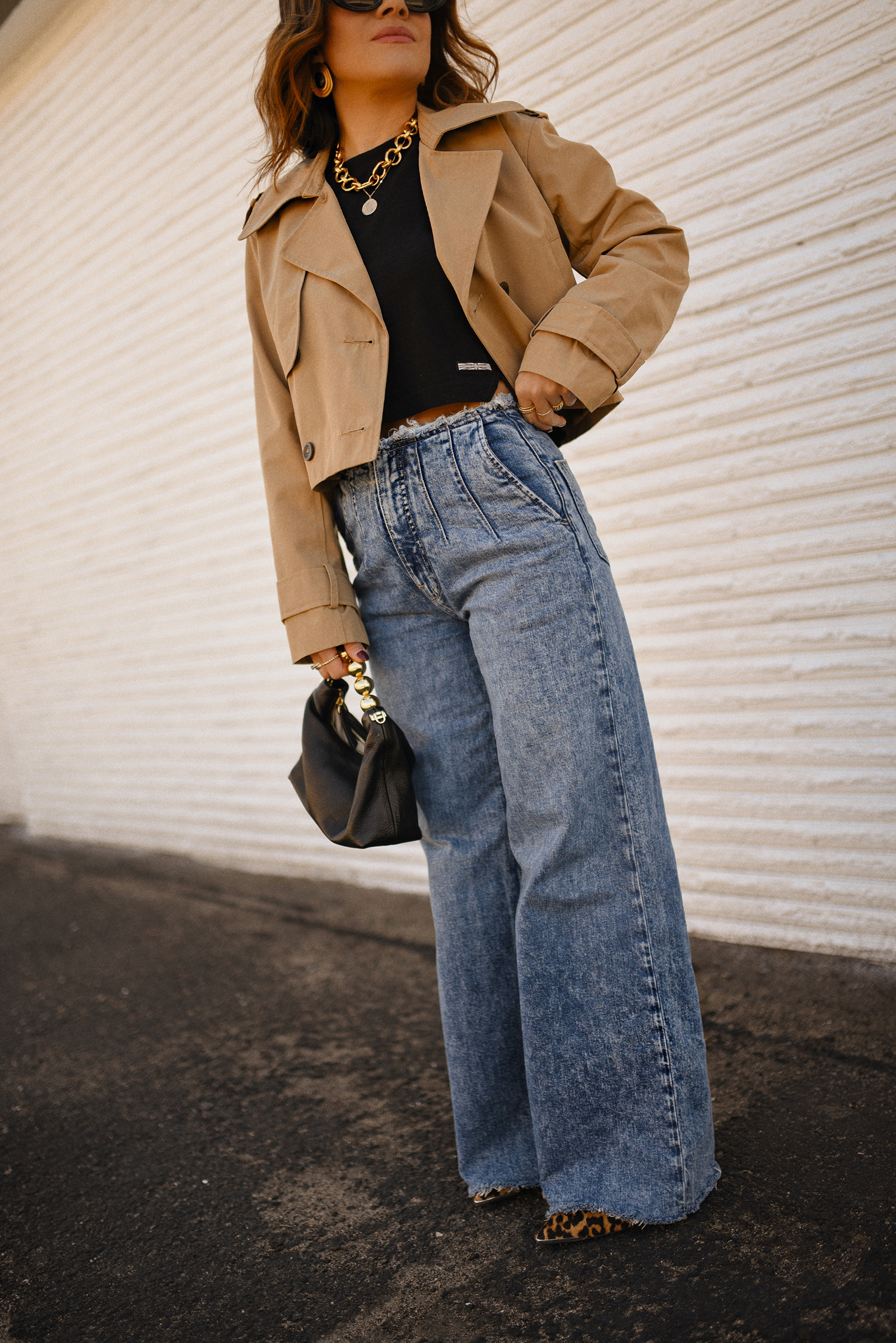 Carolina Hellal of Chic Talk wearing a short trench coat via Abercrombie, tshirt and jeans from Hudson jeans, Nordstrom animal print pumps and Amazon black handbag