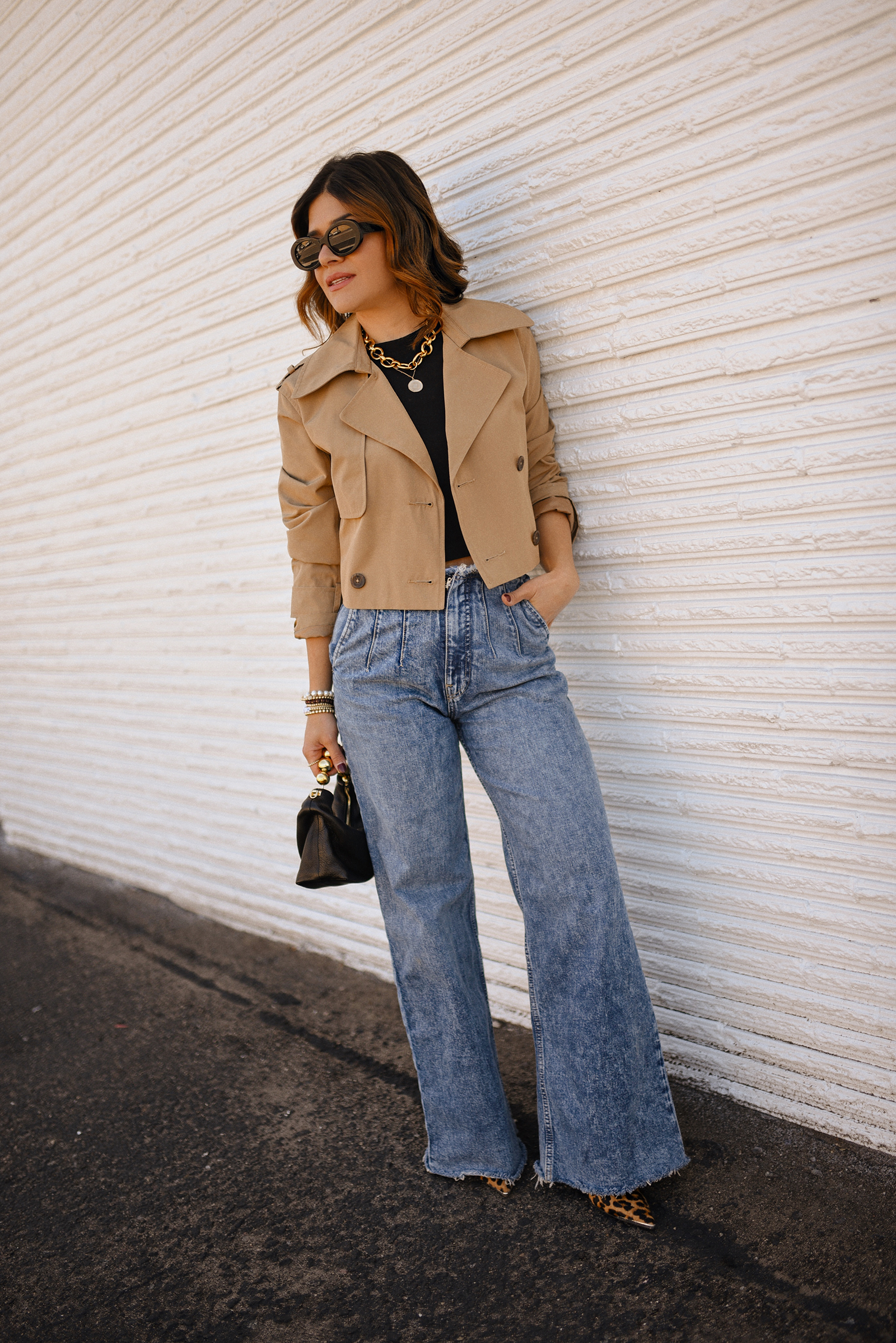 Carolina Hellal of Chic Talk wearing a short trench coat via Abercrombie, tshirt and jeans from Hudson jeans, Nordstrom animal print pumps and Amazon black handbag