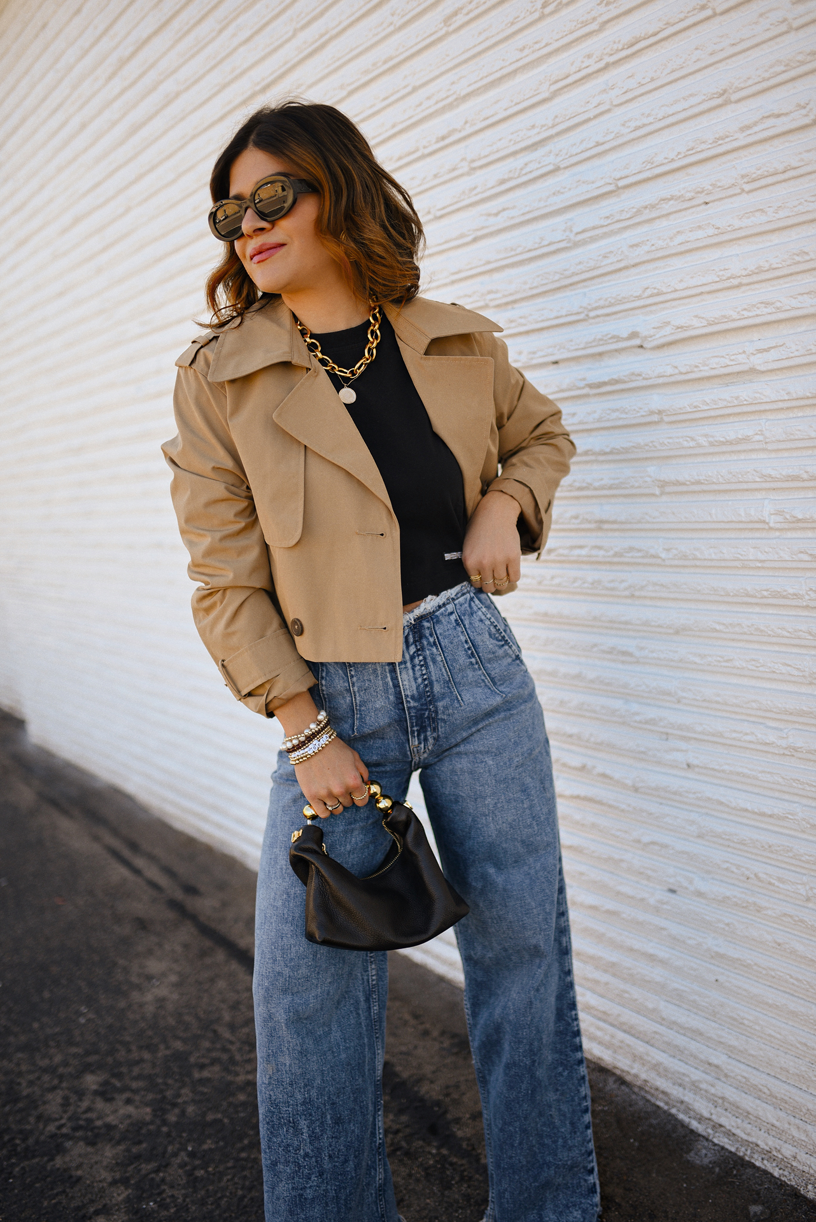 Carolina Hellal of Chic Talk wearing a short trench coat via Abercrombie, tshirt and jeans from Hudson jeans, Nordstrom animal print pumps and Amazon black handbag